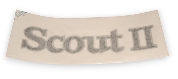 A curved beige vinyl decal sheet featuring the text 'Scout II' in a textured gray font, shown against a plain white background.