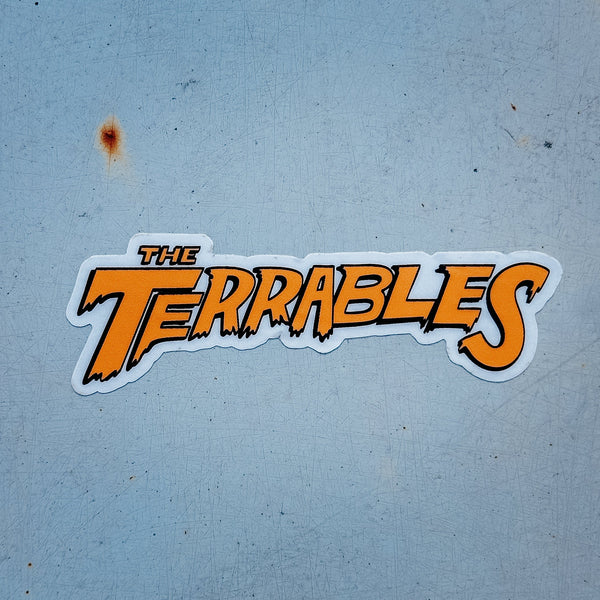 Sticker with 'The Terrables' text on a textured blue background
