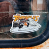 Sticker of 'The Terrables' on a vehicle window with visible rust and wear.
